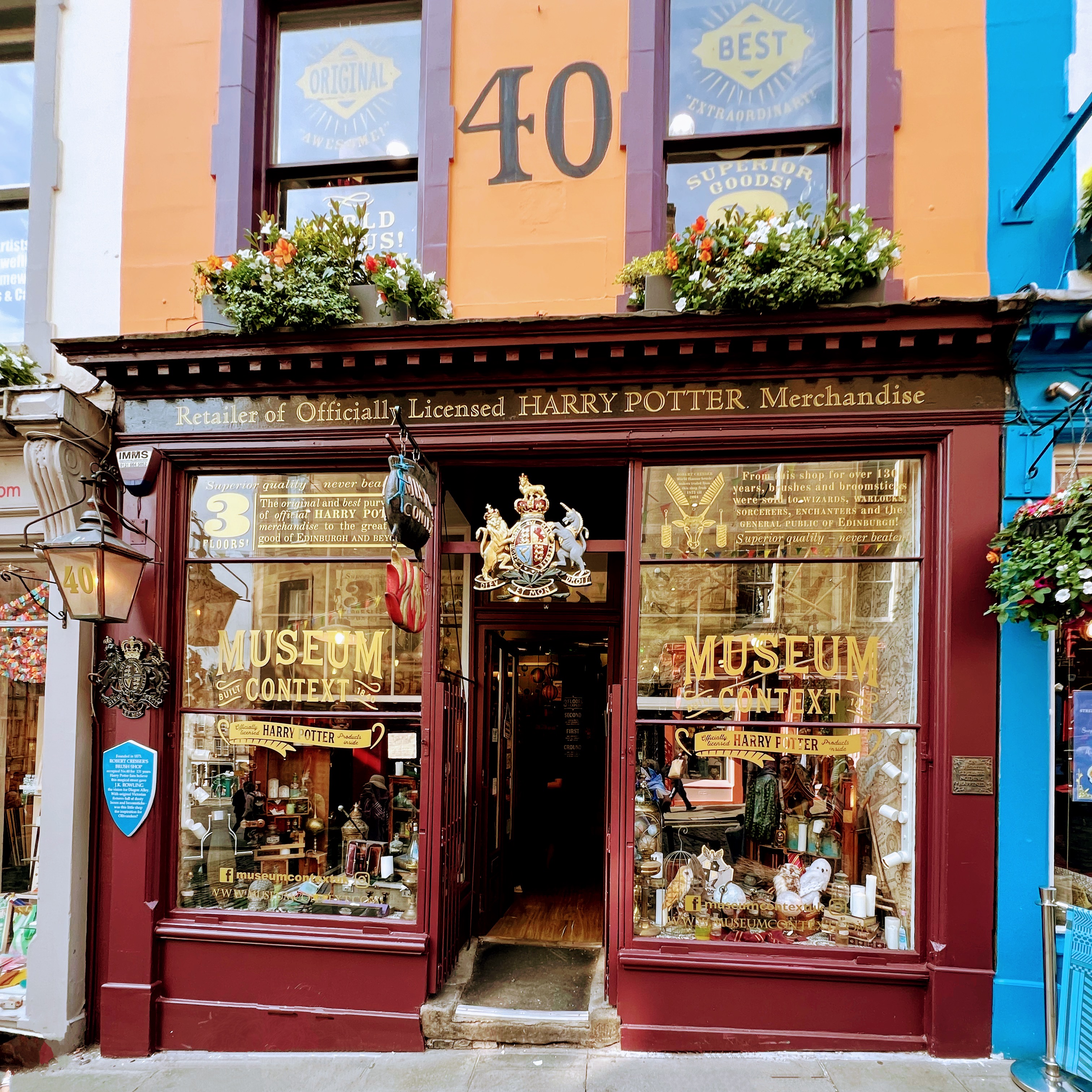 Museum Context Harry Potter shop on the Royal Mile in Edinburgh, with ornate dark wood shopfront and flower boxes
