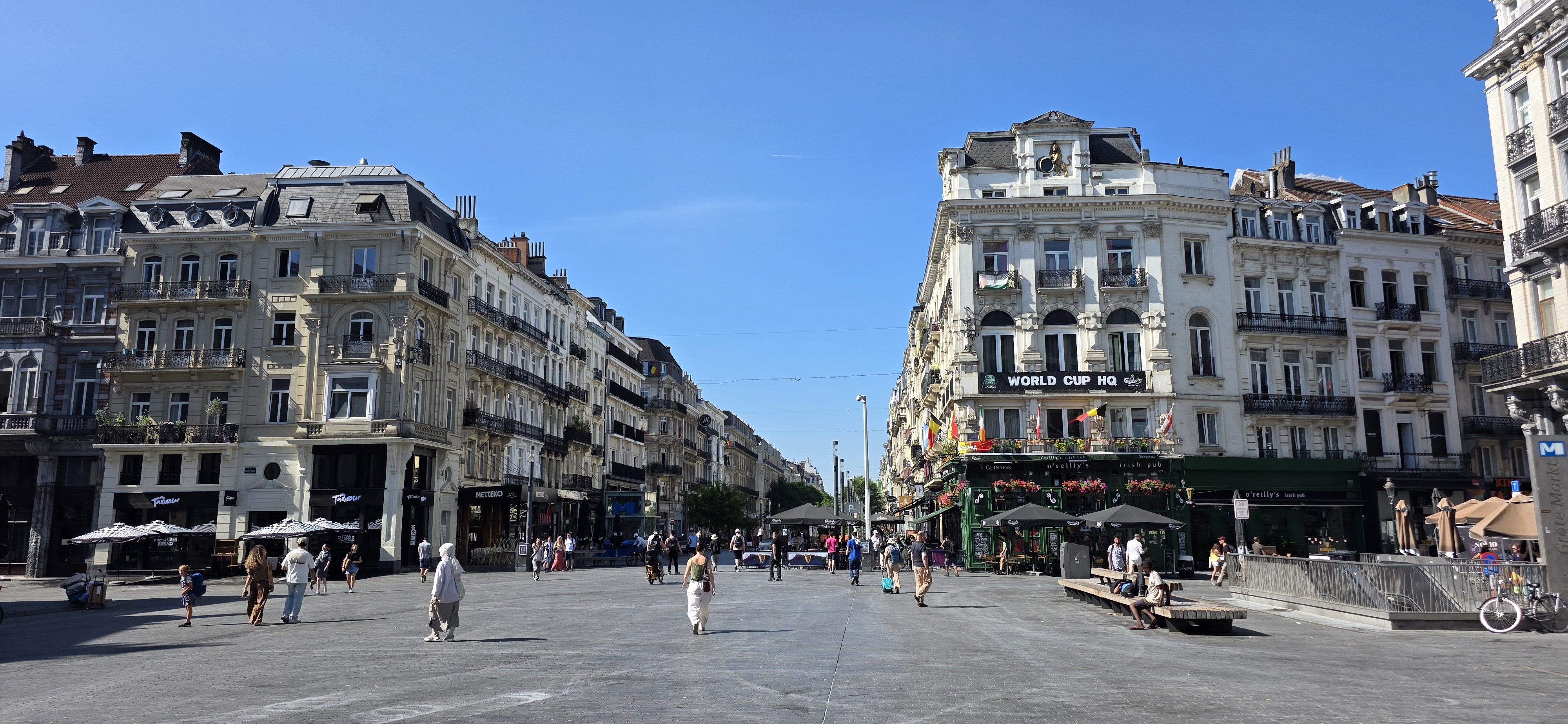 Grand nineteenth-century buildings along a wide boulevard in central Brussels